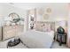 Bright bedroom with striped bedding, dresser, and tasteful decor at 1718 Cultivation Lane St # 536, Mount Pleasant, SC 29466