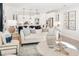 Open concept kitchen with white cabinets, an island, and stainless steel appliances at 1718 Cultivation Lane St # 536, Mount Pleasant, SC 29466