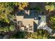 Aerial view of a house with large deck and hot tub, surrounded by lush trees at 3635 Pompano Ct, Seabrook Island, SC 29455