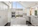 Modern kitchen features white cabinets, marble island, and stainless steel appliances at 3635 Pompano Ct, Seabrook Island, SC 29455