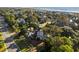 Aerial view of a charming coastal home surrounded by trees and ocean views at 3635 Pompano Ct, Seabrook Island, SC 29455