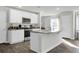Bright kitchen featuring white cabinets and a center island at 370 Spruce Ivy St, Moncks Corner, SC 29461