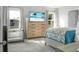 Spacious main bedroom with large dresser, TV, and a bed with patterned bedding at 370 Spruce Ivy St, Moncks Corner, SC 29461
