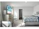 Main bedroom with a dresser, TV, and comfortable bed with blue bedding at 370 Spruce Ivy St, Moncks Corner, SC 29461