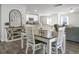 Open concept dining room with kitchen views and a charming farmhouse-style table at 370 Spruce Ivy St, Moncks Corner, SC 29461