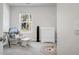 Bedroom with rocker, dresser, and window at 370 Spruce Ivy St, Moncks Corner, SC 29461