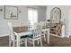 Dining room features a rustic table, built-in storage, and large windows at 370 Spruce Ivy St, Moncks Corner, SC 29461