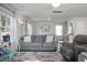 Open living room with gray seating and a view to the dining area at 370 Spruce Ivy St, Moncks Corner, SC 29461