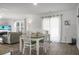 Dining area with four chairs, sliding glass doors, and living room access at 370 Spruce Ivy St, Moncks Corner, SC 29461