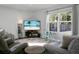 Relaxing living room with gray seating and a large window at 370 Spruce Ivy St, Moncks Corner, SC 29461