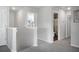 Upstairs hallway with access to bedrooms, bathroom, and bonus room at 370 Spruce Ivy St, Moncks Corner, SC 29461