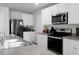 Modern kitchen with stainless steel appliances and white cabinets at 370 Spruce Ivy St, Moncks Corner, SC 29461