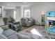 Living room with gray sofas and a view into the kitchen at 370 Spruce Ivy St, Moncks Corner, SC 29461