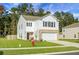 Two-story house with white siding, brick bottom, and two-car garage at 370 Spruce Ivy St, Moncks Corner, SC 29461