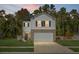 Two story house with white siding, brick bottom, and two car garage at 370 Spruce Ivy St, Moncks Corner, SC 29461