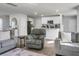 Living room featuring gray sofas and a view of the kitchen at 370 Spruce Ivy St, Moncks Corner, SC 29461