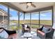 Enjoy marsh views from this screened porch with comfortable seating at 1209 Creekwatch Trace, Seabrook Island, SC 29455