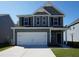 Two-story house with gray siding, white trim, and a two-car garage at 175 Cantona Dr, Summerville, SC 29483