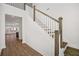 Bright entryway with hardwood floors and a staircase with white railings at 175 Cantona Dr, Summerville, SC 29483