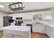Updated kitchen featuring white cabinets and a pot rack at 100 Dacs Ln, Summerville, SC 29483