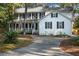 Two story white house with black shutters and porch at 100 Dacs Ln, Summerville, SC 29483