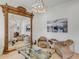 Living room with large mirror, leather chairs, and coffee table at 1471 Tomato Farm Cir, Mount Pleasant, SC 29464