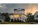 Two-story home with white siding, black windows, and a front porch at 1471 Tomato Farm Cir, Mount Pleasant, SC 29464