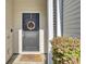 Dark gray front door with a nautical wreath at 102 Woodward Rd, Goose Creek, SC 29445