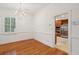Dining room with hardwood floors and kitchen access at 175 Wentworth St # A, Charleston, SC 29401