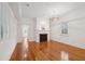 Living room with hardwood floors, fireplace, and large windows at 175 Wentworth St # A, Charleston, SC 29401