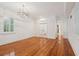Bright dining room features hardwood floors, crown molding, and a chandelier at 175 Wentworth St # A, Charleston, SC 29401