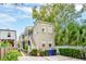 Tan colored building exterior with a charming staircase and landscaping at 175 Wentworth St # A, Charleston, SC 29401