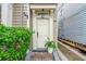 Charming front door entrance with brick walkway and lush landscaping at 175 Wentworth St # A, Charleston, SC 29401