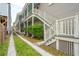 Exterior view of the home, showcasing the side yard and stairs at 175 Wentworth St # A, Charleston, SC 29401