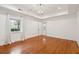 Well-lit bedroom, featuring hardwood floors and a window at 175 Wentworth St # A, Charleston, SC 29401