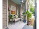 Relaxing front porch with seating area, perfect for enjoying the outdoors at 175 Wentworth St # A, Charleston, SC 29401
