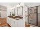 Bathroom boasts double sinks, granite counters, and a walk-in shower at 175 Wentworth St # A, Charleston, SC 29401