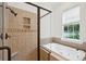 Spa-like bathroom with soaking tub and walk-in shower at 175 Wentworth St # A, Charleston, SC 29401