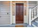 Dark brown front door with sidelights and a storm door at 175 Wentworth St # A, Charleston, SC 29401