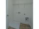 Laundry room with shelving and a drain in the floor at 1103 Twin Rivers Drive # 71, Wando, SC 29492