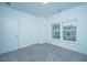 Bright bedroom with neutral carpeting and two large windows at 1103 Twin Rivers Drive # 71, Wando, SC 29492
