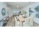 Open concept dining area with adjacent living room and kitchen at 1103 Twin Rivers Drive # 71, Wando, SC 29492