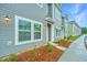 Gray townhome with landscaping and walkway at 1103 Twin Rivers Drive # 71, Wando, SC 29492