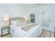 Main bedroom with plush bed, neutral tones and private access door at 1103 Twin Rivers Drive # 71, Wando, SC 29492