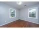 Bedroom with hardwood floors and two windows at 112 A & B Cone Ln, Summerville, SC 29483