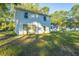 White two-story home with attached garage and large yard at 112 A & B Cone Ln, Summerville, SC 29483