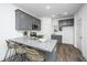 Modern kitchen with gray cabinets, granite countertops, and stainless steel appliances at 208 Cache Ct # 5, Charleston, SC 29414