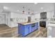 Modern kitchen with white cabinets, blue island, and copper sink at 4429 Francis Younge Way, Hollywood, SC 29449