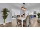 Bright dining area with hardwood floors and an open view to the kitchen at 4429 Francis Younge Way, Hollywood, SC 29449