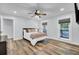 Spacious bedroom with hardwood floors and access to the bathroom at 4429 Francis Younge Way, Hollywood, SC 29449